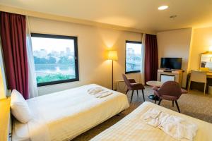 Ένα ή περισσότερα κρεβάτια σε δωμάτιο στο Hotel Sanderson