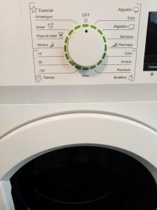 a close up of a white washing machine at A Casiña da Ponte in Padrón +18 photos