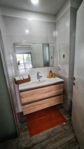 a bathroom with a sink and a mirror at Ben house in Tiberias