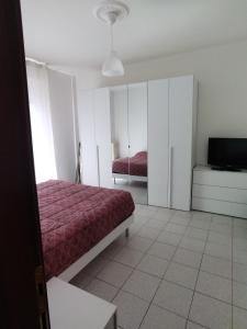 Кровать или кровати в номере Appartamento Anselmo