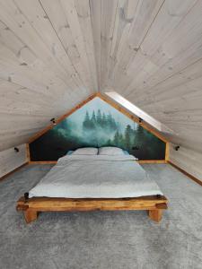 Postel nebo postele na pokoji v ubytování Domki nad Jeziorem Sunia