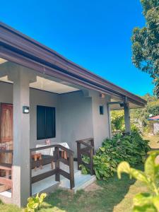 a small house with a tv on the side of it at Zara's Casa Rental in Siquijor