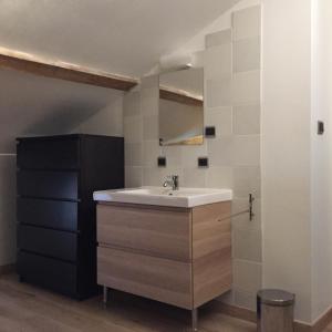 a bathroom with a sink and a mirror at Maison Dufraing - Anan in Anan