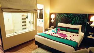 Postel nebo postele na pokoji v ubytování Signature Hotel Al Barsha