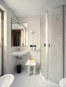 a bathroom with a shower and a sink at Hotel Commercio & Pellegrino in Venice