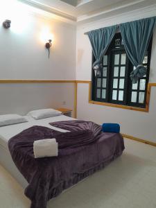 Postel nebo postele na pokoji v ubytování Ocean Beach Guraidhoo