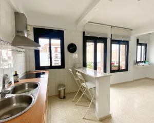 a kitchen with a sink and a counter top at Dúplex Centro Écija in Écija