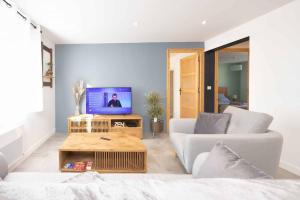Televízia a/alebo spoločenská miestnosť v ubytovaní Appartement Modane Wifi stationnement gratuit