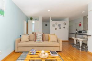a living room with a couch and a table at Sunny Oporto, Douro Apartments in Porto