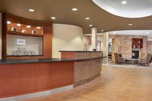 a lobby of a hotel with a reception counter at Courtyard by Marriott Sacramento Folsom in Folsom