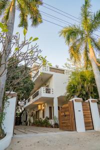 a house with palm trees in front of it at Anchorage 42 in Chandīgarh