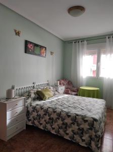 Ένα ή περισσότερα κρεβάτια σε δωμάτιο στο Reina Amalia +8 φωτογραφίες