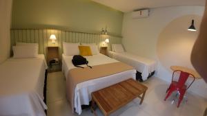 A bed or beds in a room at Hotel Pousada da Lapa