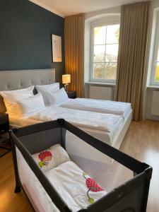 Postel nebo postele na pokoji v ubytování DK Hotel Heidelberg