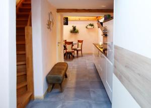 a hallway with a kitchen and a table with chairs at Apartment Basedow in Basedow
