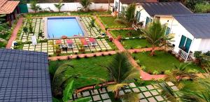 an aerial view of a backyard with a swimming pool at White Truffle Resort, Arambol in Arambol
