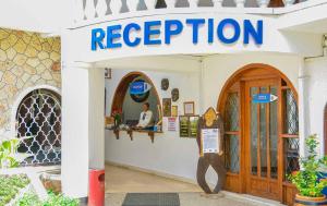 a store with a sign that reads reception at Jangwani Sea Breeze Resort in Dar es Salaam
