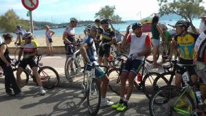 a group of people on bikes on a street at Casa Villa Las Encinas in Pollença