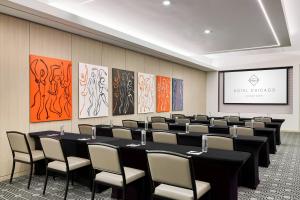 a conference room with a long table and chairs at Hotel Chicago Downtown, Autograph Collection in Chicago