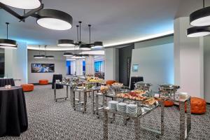 a cafeteria with a buffet of food on display at Hotel Chicago Downtown, Autograph Collection in Chicago