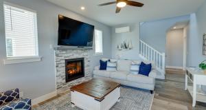 a living room with a couch and a fireplace at Deja Blue in Ocean Shores