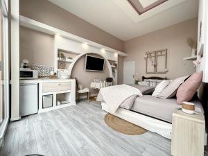 Televízia a/alebo spoločenská miestnosť v ubytovaní Chambre avec spa, piscine et sauna privatif