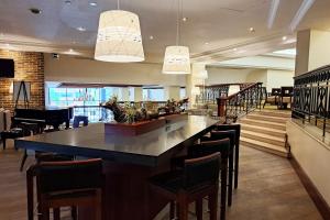 a restaurant with a large island in the middle of a room at JW Marriott Caracas in Caracas