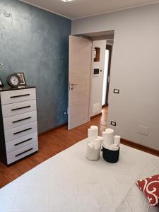 a room with a bed and a dresser and a bedroom at La casa in piazzetta in Enna