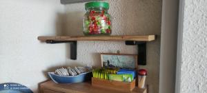 a wooden shelf with a jar on a wall at Appartement de vacances - Splendide vue sur mer, Parking privé in Le Barcarès