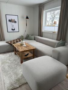 a living room with a couch and a table at Lofoten Kabelvåg-small apartment in Kabelvåg