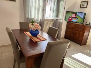TV a/nebo společenská místnost v ubytování Casa vacanze Diana