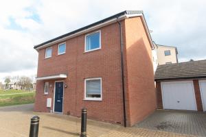 a red brick house with a white garage at Three Bedroom Semi Detached House By Flipside Property Aylesbury Serviced Accommodation & Short Lets With Wifi & Parking in Aylesbury