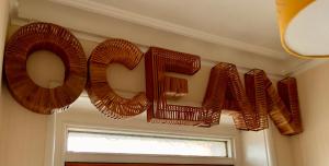a sign that says ego hanging on a ceiling at Romantic luxury Cottage right next to the ocean in Saint Abbs