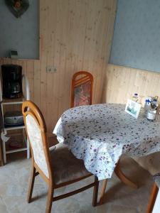 a table in a room with a table and chairs at Erholung-pur in Hennstedt +14 photos