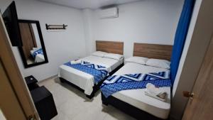 Postel nebo postele na pokoji v ubytování Hotel Real del Valle