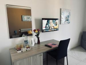 Телевізор і / або розважальний центр в Seaside Accomodation