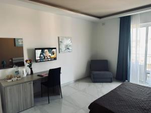 TV a/nebo společenská místnost v ubytování Seaside Accomodation