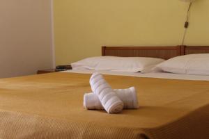 Postel nebo postele na pokoji v ubytování Piccolo Hotel Nuova gestione