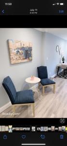 a living room with two chairs and a table at Beautiful master bedroom with private bathroom in Baltimore