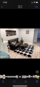a living room with a couch and a checkered rug at Beautiful master bedroom with private bathroom in Baltimore