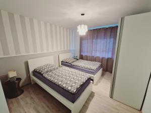 Posteľ alebo postele v izbe v ubytovaní Apartment Nordtraum