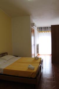 Postel nebo postele na pokoji v ubytování Piccolo Hotel Nuova gestione