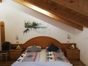 Postel nebo postele na pokoji v ubytování Hotel Aida