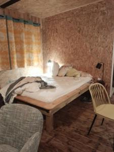 سرير أو أسرّة في غرفة في Le K 'Ré de Dada