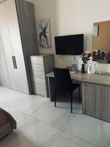 Телевізор і / або розважальний центр в Seaside Accomodation