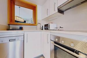 Kuchyň nebo kuchyňský kout v ubytování Precioso apartamento en Macenas