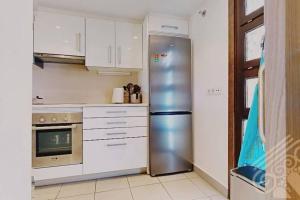Kuchyň nebo kuchyňský kout v ubytování Precioso apartamento en Macenas