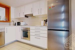 Kuchyň nebo kuchyňský kout v ubytování Precioso apartamento en Macenas