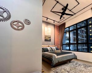 a bedroom with a bed and a ceiling fan at UrbanRuma#Industrial#Putrajaya#500Mbps#Netflix in Putrajaya