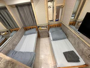 Ένα ή περισσότερα κρεβάτια σε δωμάτιο στο T A B Hotel